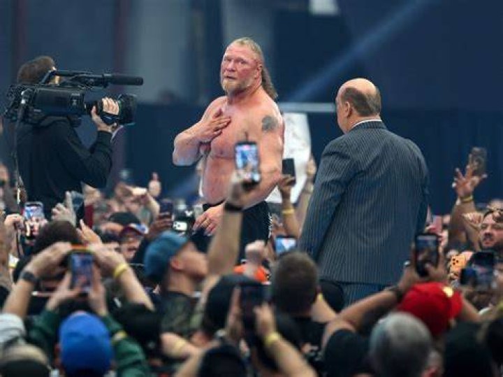 Brock Lesnar interrupts Edge & Christian photos WWE